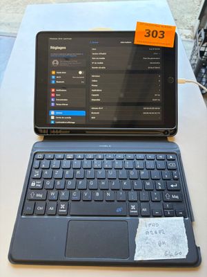 a laptop computer sitting on top of a table with a price tag on it
