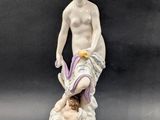 figurine of a man and a woman on a marble base