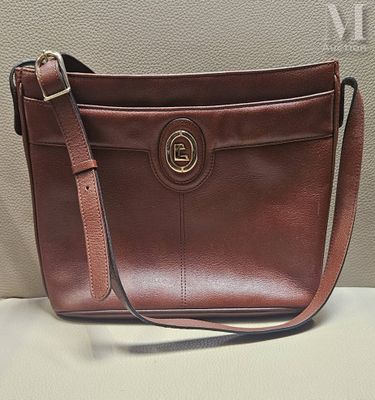 sac à main Coach en cuir marron avec des finitions dorées