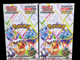 two packs of pokemon trading cards on a black background