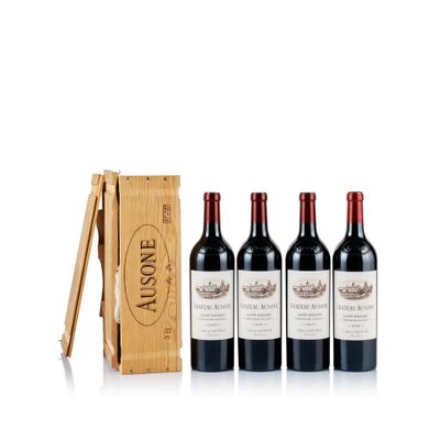 three bottles of red wine in a wooden box