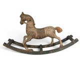 wooden rocking horse on a white background on a white surface