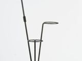 a lamp that is on a stand with a lamp on it