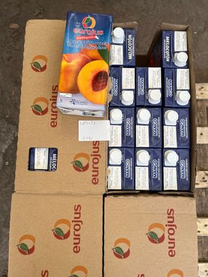 several boxes of fruit are stacked on top of a pallet