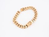 a gold bracelet on a white background