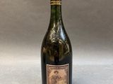 a bottle of wine sitting on top of a table