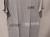 a grey t - shirt with the word core on it hanging on a hanger