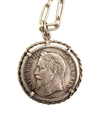 an image of a silver coin with a chain on a white background