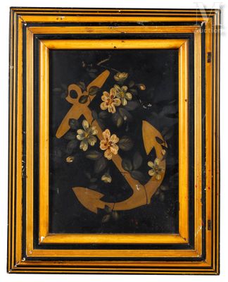 painting of an anchor and flowers in a gold frame on a white background
