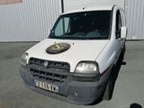 a white van that is parked in front of a building
