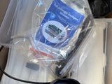 a box with a laptop and other items inside of it