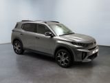 the new toyota rav is parked in a room with a white wall