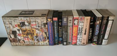 a lot of books that are stacked on top of each other