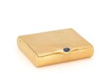 an image of a gold box with a blue stone in it