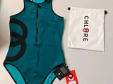 a close up of a bathing suit and a bag on a table