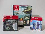 three nintendo wii game controllers sitting next to each other on a white surface