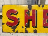 a yellow and red sign that says she on it