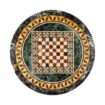 an image of a round marble table top with a checkerboard pattern