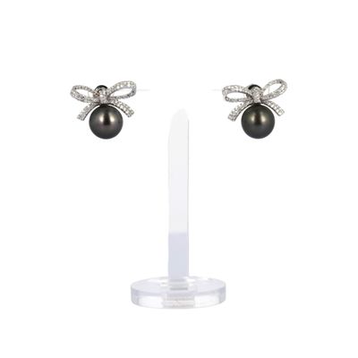 a pair of black pearl and diamond earrings
