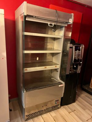 an image of a refrigerator in a room with a red wall