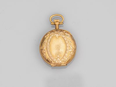 an image of a gold pocket watch with a picture of a woman