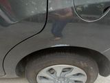 a picture of a car that is parked on the side of the road