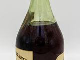an image of a bottle of liquor sitting on top of a table