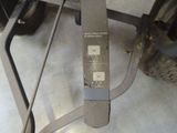 a close up of a skateboard on a stand in a garage
