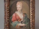 un tableau représentant une femme tenant un chat dans ses bras