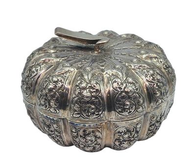 a silver box that is sitting on a white surface