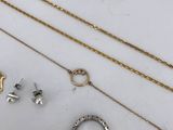 a collection of gold and silver jewellery