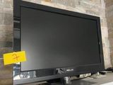 un téléviseur à écran plat posé sur un meuble TV