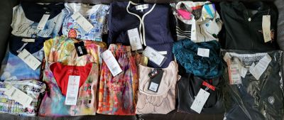 a suitcase full of clothes and clothes that are packed together