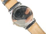 a person taking a picture of a watch with a camera