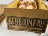 a cardboard box with a bunch of doughnuts inside of it