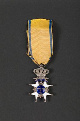 a close up of a medal on a black surface