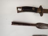 three different types of tools on a white surface