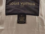 a louis vuitton jacket with a black label on it