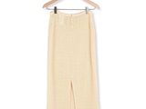 the pants are hanging on a hanger on a white wall