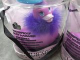 two plastic cups that have a purple duck inside of them