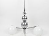 a chandelier with three balls hanging from the ceiling