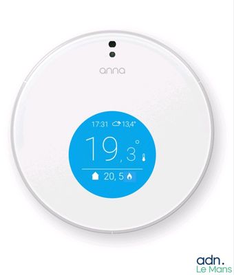a white smart thermosta with a blue button on it