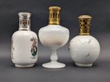 three vases that are sitting next to each other on a table
