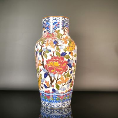 a vase that is sitting on a table in a room