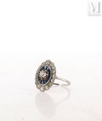 a close up of a ring on a table with a white background