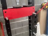 an image of a hydraulic press in a garage