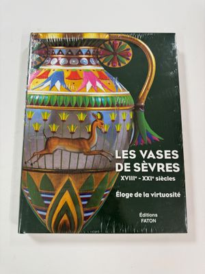 a book with a picture of a vase on it
