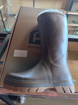a box with a pair of rain boots on top of it