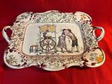 a plate with a picture of a man and a woman on it