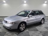 a picture of a silver car parked in a garage